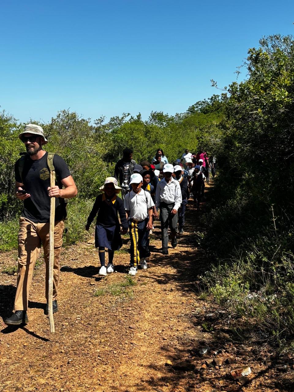 VWRA veteran leading schoolchildren on a guided hike across the reserve