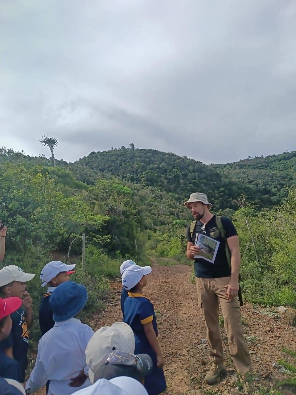 Wildlife talk on a reserve trail with local schoolchildren